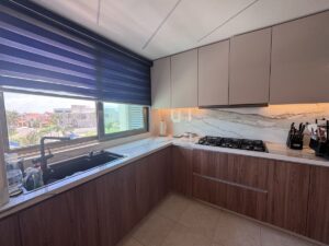 Cocina con acabados modernos en departamento en venta en Zona Hotelera Cancún